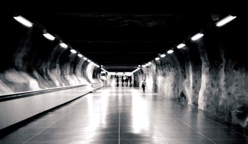 Underground walkway with empty subway