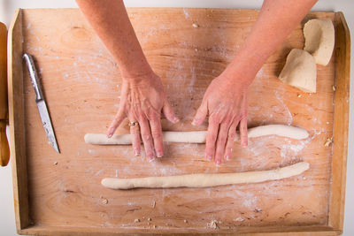 High angle view of person preparing food on table