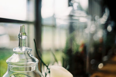 Close-up of glass bottle on table