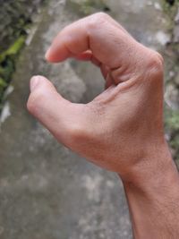 Close-up of hands on human hand