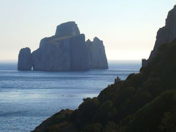 Scenic view of rock formations in sea