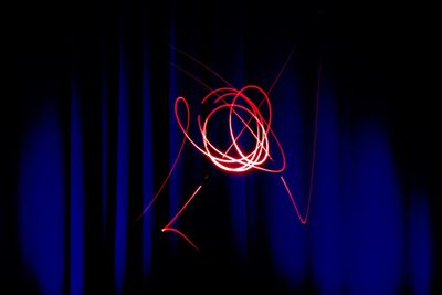 Close-up of light painting against black background