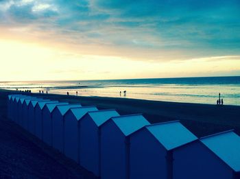 Scenic view of beach and sea against sky during sunset