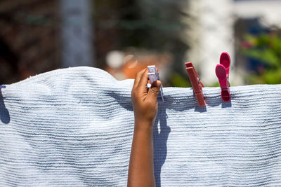 Close-up of hand holding cigarette