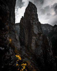 Low angle view of rocks against sky