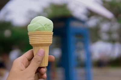 Hand holding ice cream cone