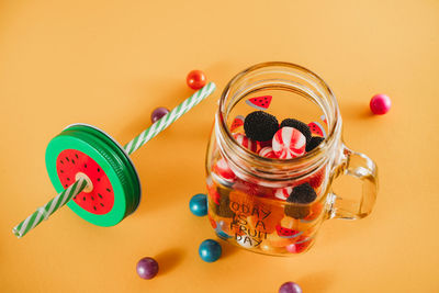 High angle view of candies in glass jar on table
