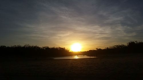 Scenic view of silhouette trees against sky during sunset