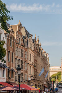 Buildings in city against sky