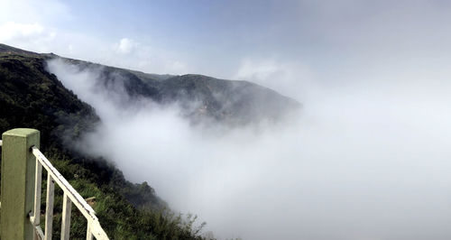 Scenic view of waterfall against sky