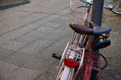 High angle view of bicycle parked on footpath