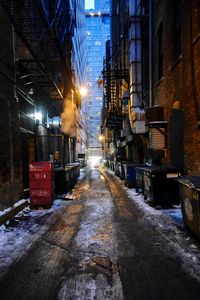 Illuminated city street at night