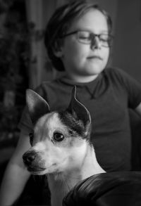 Portrait of kid with dog at home