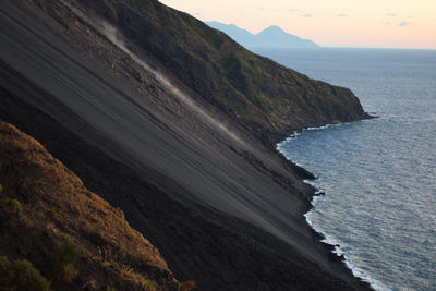 Scenic view of stromboli steep in sea