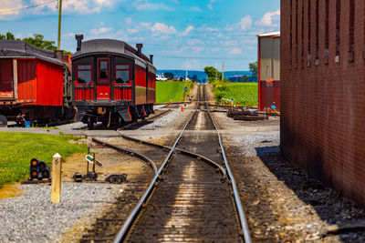 Train on railroad track against sky