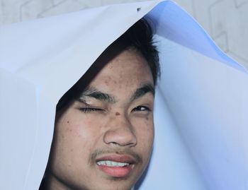 Close-up portrait of young man smiling