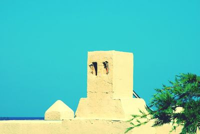 Low angle view of built structure against blue sky