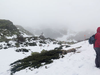 Scenic view of snowcapped mountains against sky during winter