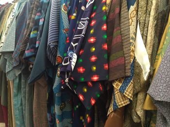 Panoramic shot of clothes hanging on display for sale