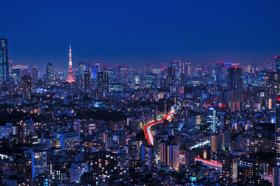 Illuminated cityscape against sky at tokyo night