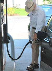 Full length of man photographing car