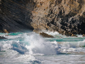 Sea waves splashing on rocks