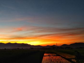 Scenic view of silhouette landscape against sky during sunset