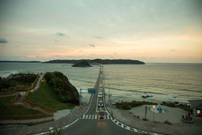 High angle view of road by sea against sky