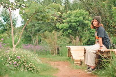 Portrait of young man standing in park