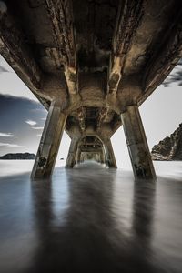 Underneath view of pier over sea