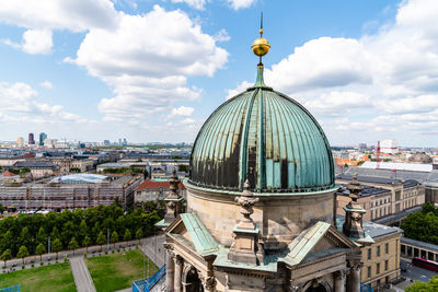 Panoramic view of buildings in city against sky