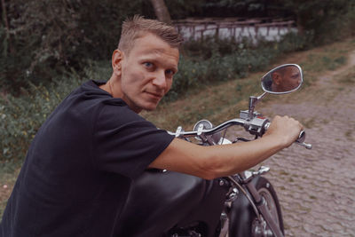 Portrait of man riding bicycle