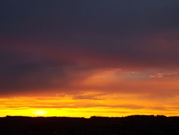 Silhouette of landscape against dramatic sky