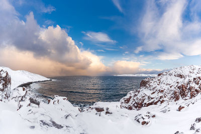 Scenic view of sea against sky during winter