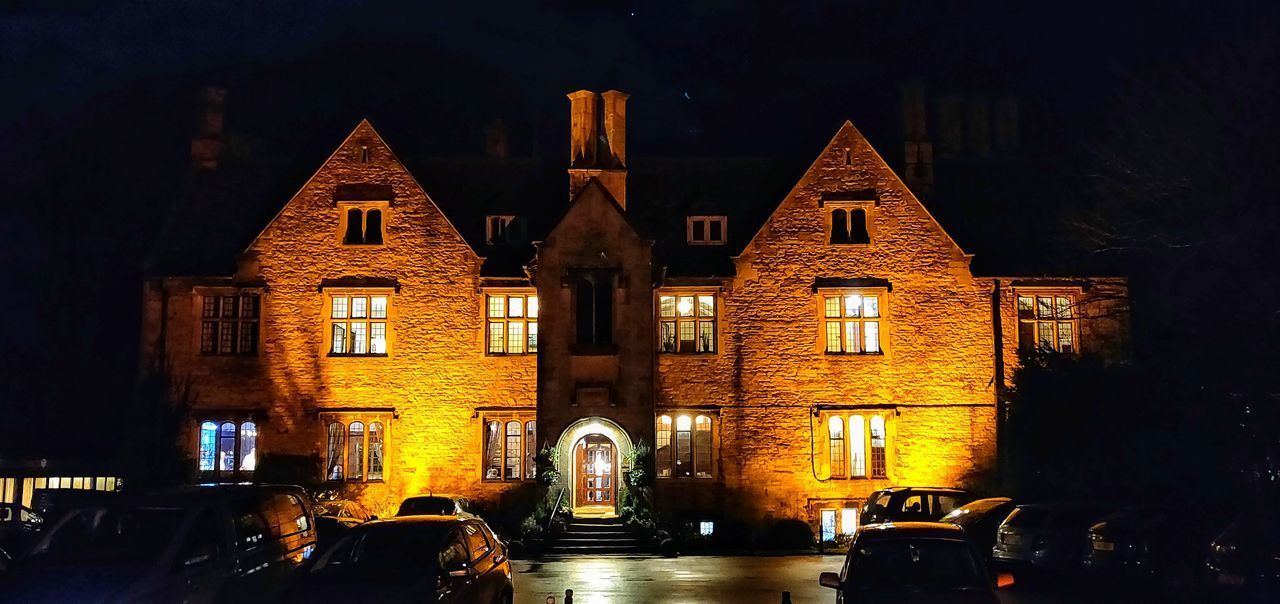 VIEW OF ILLUMINATED BUILDINGS AT NIGHT