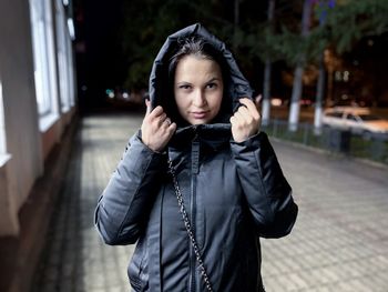 Portrait of woman standing in snow