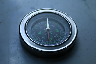 Close-up of compass on table