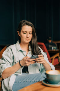 Young woman using mobile phone