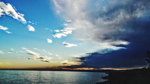 Scenic view of sea against cloudy sky