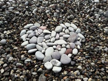 High angle view of stones on pebbles