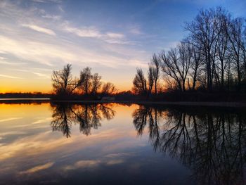 Scenic view of lake against sky during sunset