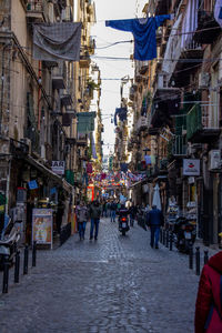 People walking on street in naples