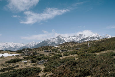 Scenic view of snowcapped mountains against sky