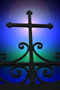 Low angle view of cross against blue sky