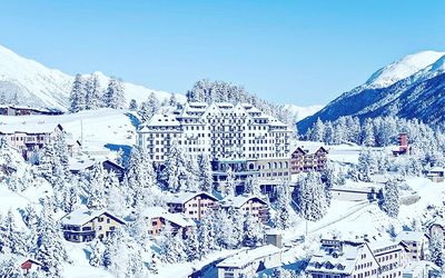 Snow covered mountain against clear blue sky