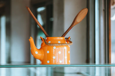 Close-up of orange art on table