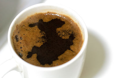 High angle view of coffee cup on table