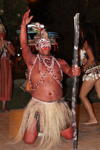 Close-up of man dancing at night