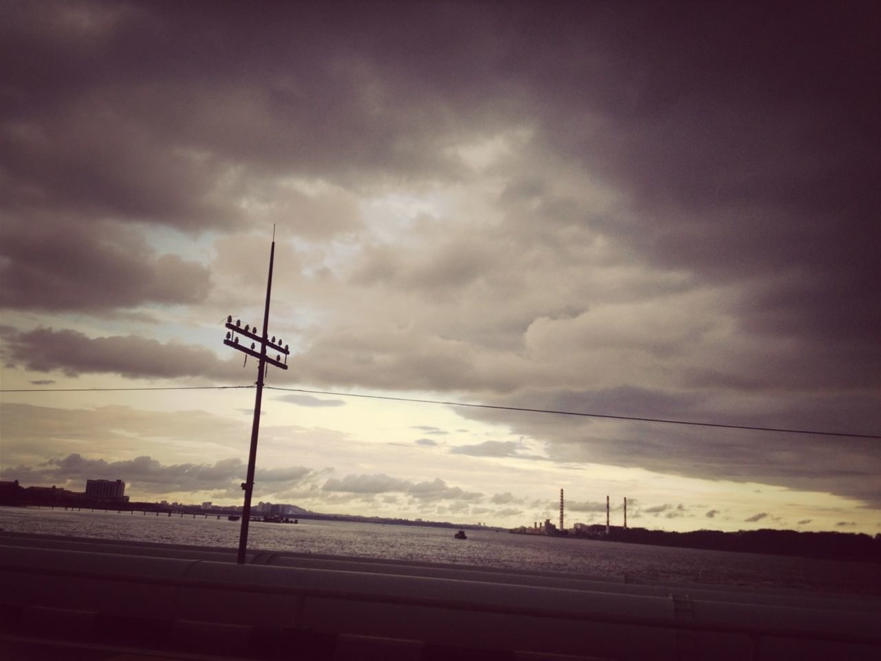 sky, cloud - sky, cloudy, weather, street light, power line, overcast, cloud, electricity, low angle view, electricity pylon, connection, dusk, sunset, nature, cable, lighting equipment, fuel and power generation, power supply, dramatic sky