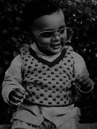 Close-up portrait of young woman wearing sunglasses